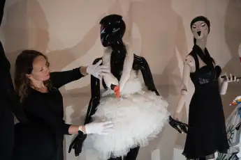 Rebel: 30 Years Of London Fashion Sponsored by Alexander McQuee Press Preview - Design Museum, London A staff member adj