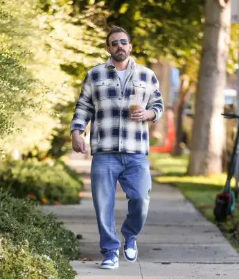 Ben Affleck is seen with his iced coffee drink while dropping off son Samuel Affleck. Featuring: Ben Affleck Where: Los