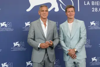 American actors George Clooney and Brad Pitt at the 81 Venice International Film Festival 2024. Wolfs (Lobos) photocall.