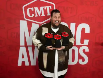Syndication: The Tennessean Jelly Roll celebrates on the red carpet after winning three awards at the 2024 CMT Music Awa