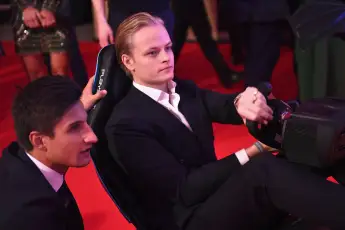 Princess Mette-Marit's son Marius Borg Høiby playing the Formula E simulator at the BRITS Aftershow Party