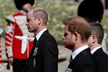 Prince William and Prince Harry at Prince Philip's funeral. Heir to the throne William fights back tears