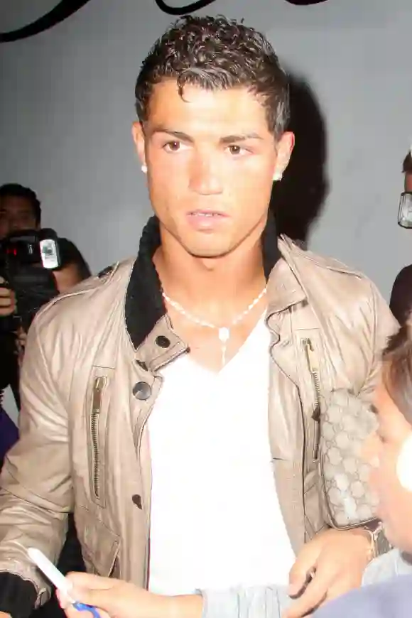 With his Gucci manbag tucked under his arm, Cristiano Ronaldo pays a visit to Eva Longoria s Beso restaurant 31739, WEST