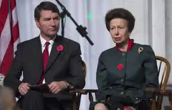Princess Anne and her current husband, Admiral Timothy, matched her scarf and tie along with an outfit that showed off the color red. Subtle but noticeable.