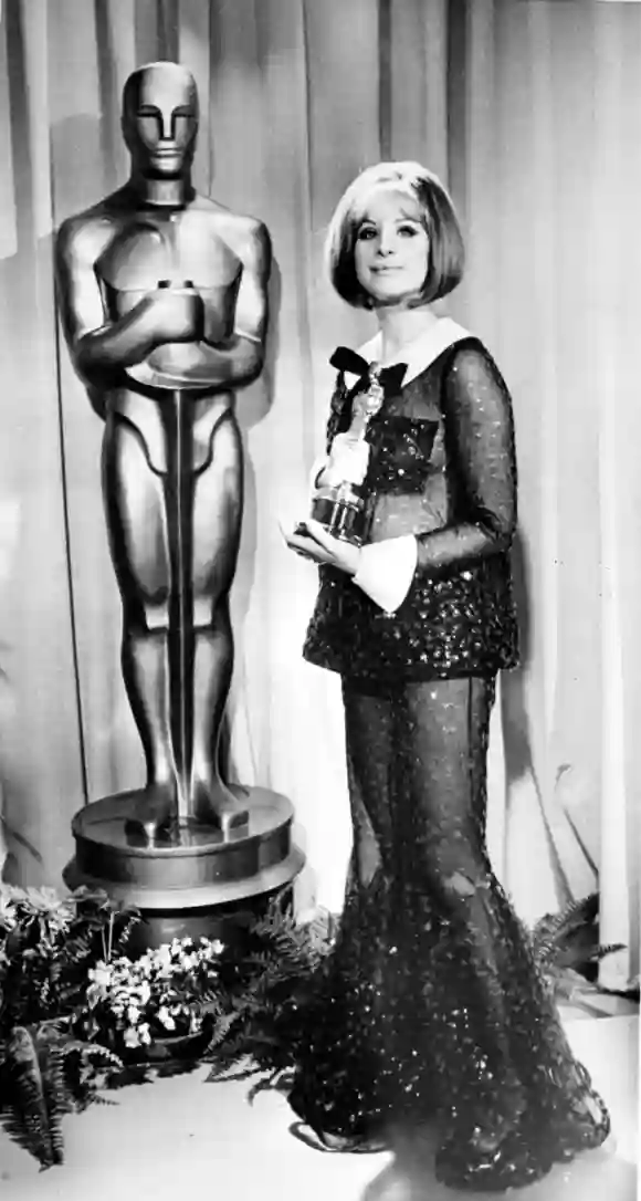 Los Angeles American actress Barbra Streisand holds her Oscar after she was named joint winner of t
