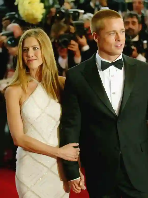 Brad Pitt and Jennifer Aniston attend the World Premiere of epic movie "Troy" at Le Palais de Festival on May 13, 2004 in Cannes, France.