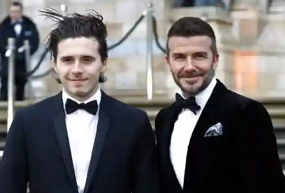 Brooklyn Beckham and David Beckham attend the "Our Planet" global premiere at Natural History Museum.