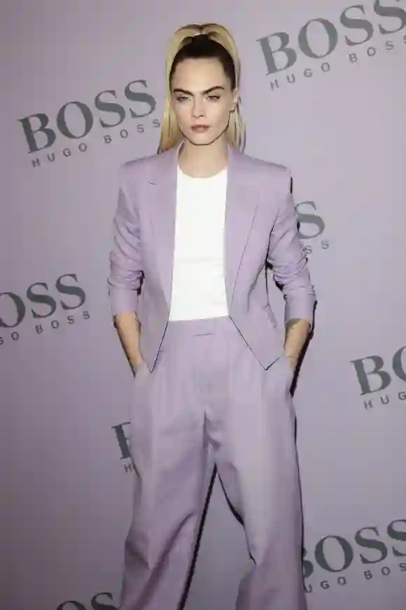 Cara Delevingne attends the BOSS fashion show during the Milan Fashion Week.