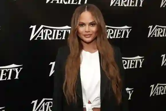 Chrissy Teigen, from the film The Way Down: God, Greed, and the Cult of Gwen Shamblin, poses at the Variety Studio