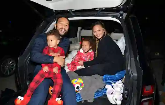 Chrissy Teigen and John Legend attend the 2020 drive-in premiere of Netflix's 'Jingle Jangle' with their kids