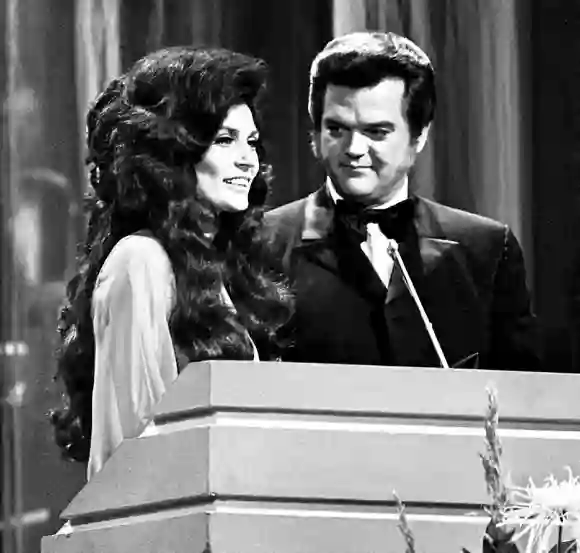 Syndication: Daytona Beach News-Journal Conway Twitty (right), seen here picking up the 1972CMA Award for Vocal Duo of t