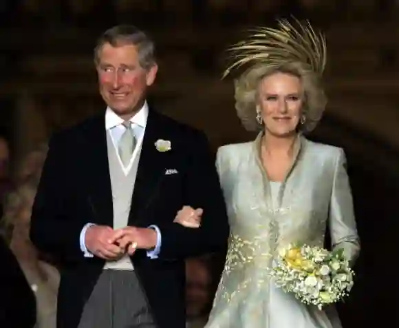 WINDSOR, United Kingdom: Prince Charles and Camilla, the Duchess of Cornwall leave a blessing at St. Georges Chapel in Windsor Castle after their civil wedding 09 April, 2005.   AFP PHOTO/TOBY MELVILLE/WPA POOL (Photo credit should read TOBY MELVILLE/AFP via Getty Images)