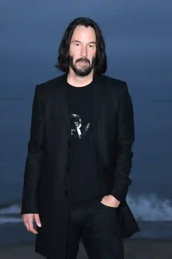 Keanu Reeves arrives for the Saint Laurent Men's Spring-Summer 2020 runway show.