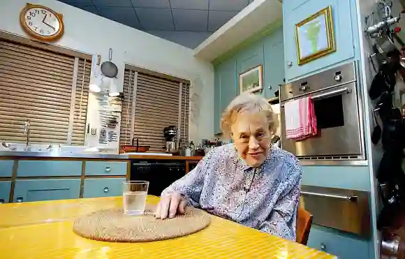 Julia Child sits in her kitchen after being moved