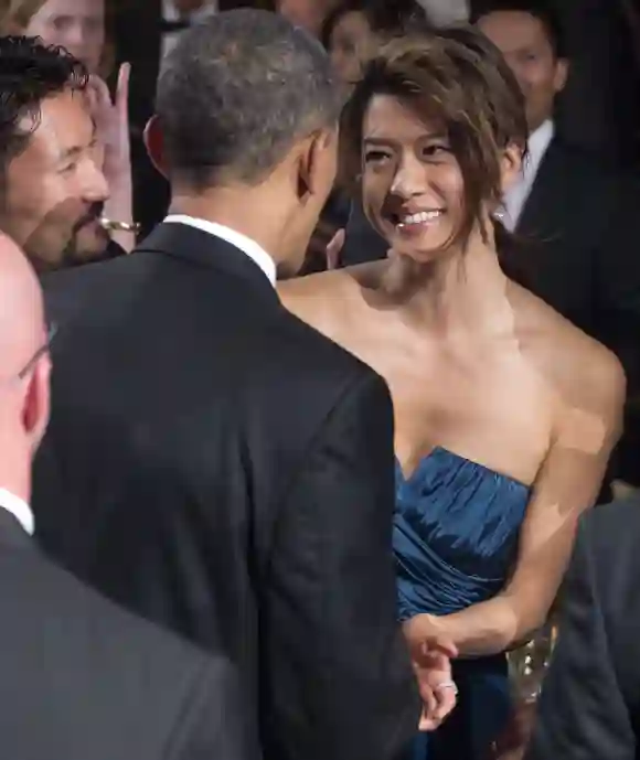 Barack Obama shakes hands with Grace Park at the Congressional Asian Pacific American Institute of Congressional Studies, 2012.