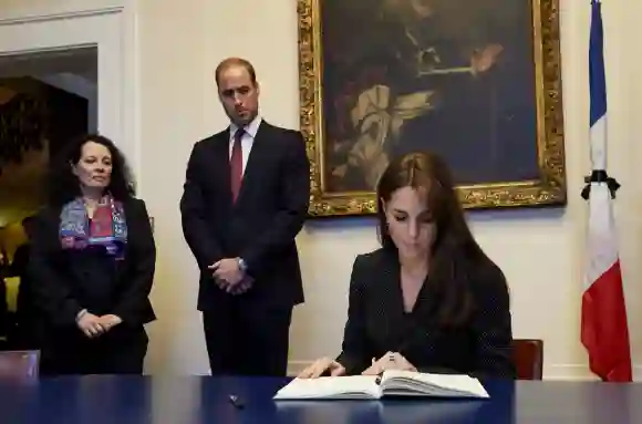 Duchess Kate and Prince William sign the book of condolence for the victims of Paris