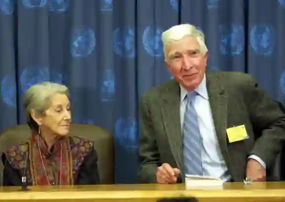 US author John Updike (R) speaks beside