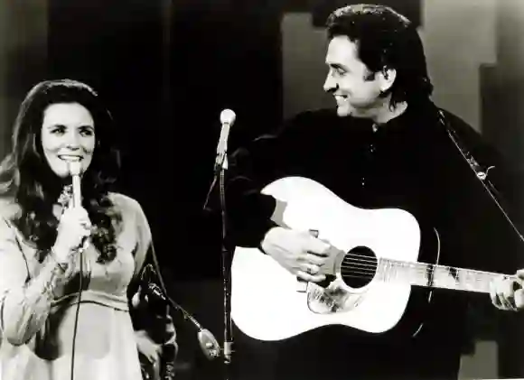 Johnny And June Carter Cash performing on stage