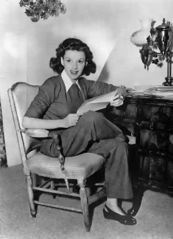 1944: American film actress Judy Garland (1922 - 1969) at home answering fan mail.