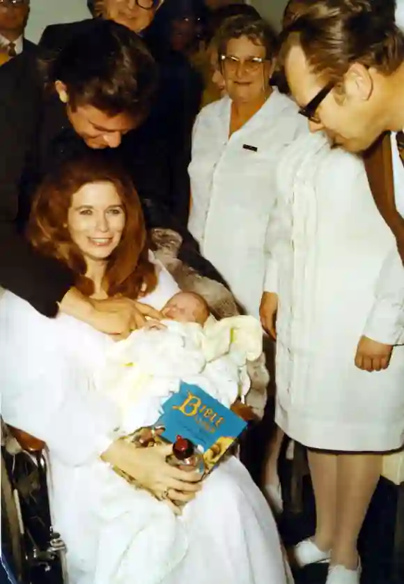 JUNE CARTER CASH AND HUSBAND JOHNNY CASH.WITH THEIR NEW BABY.