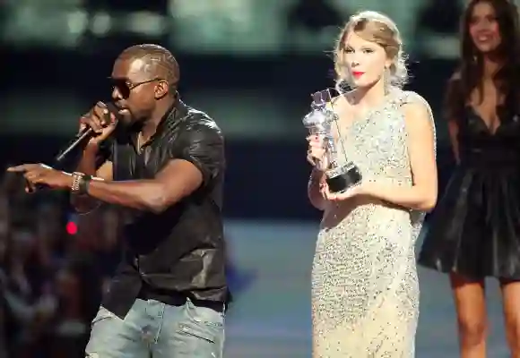 Kanye West jumps onstage after Taylor Swift won the "Best Female Video" award during the 2009 MTV Video Music Awards at Radio City Music Hall on September 13, 2009