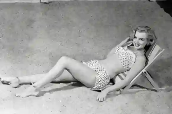 Marilyn Monroe posing in swimsuit