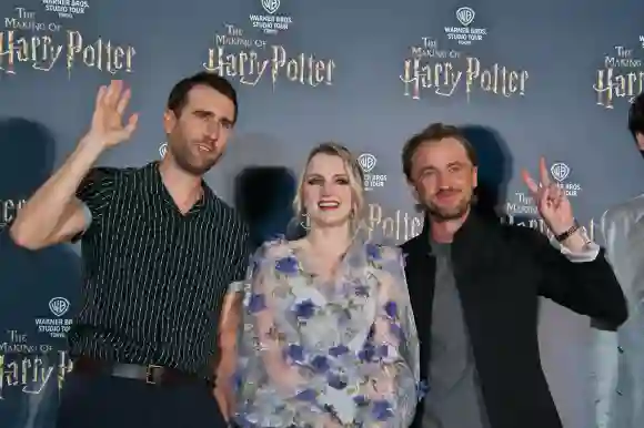 (L-R) Actors Matthew Lewis, Evanna Lynch and Tom Felton attend the pre open event for the entertainment facility Warner