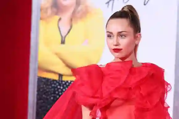 Miley Cyrus attends the premiere of "Isn't It Romantic"