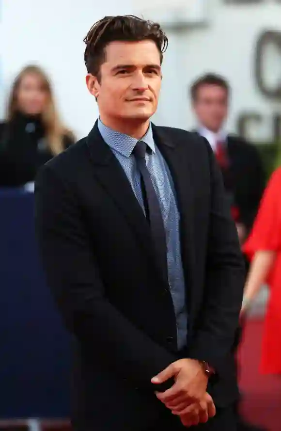 Orlando Bloom poses on the red carpet before the screening of the movie "Sleeping with other people".