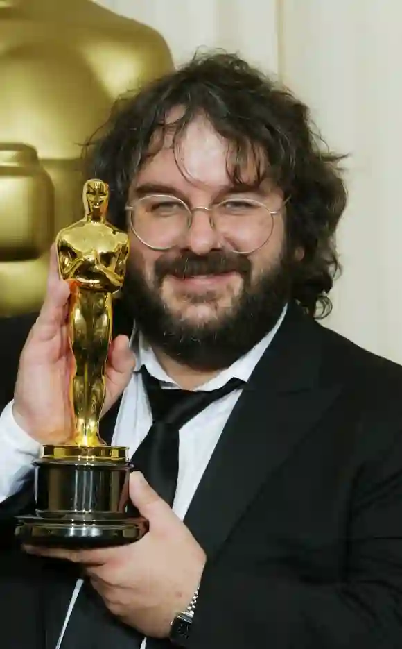 The Lord of the Rings director Peter Jackson poses with his Oscar for Best Director at the 76th Academy Awards in 2004.