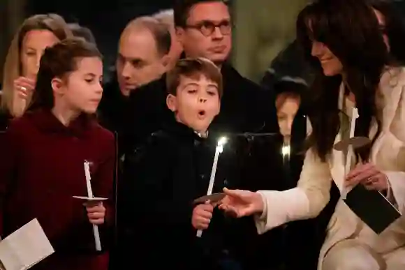 Together at Christmas Carol Service (left to right) Princess Charlotte, Prince Louis blowing out his candle and the Prin