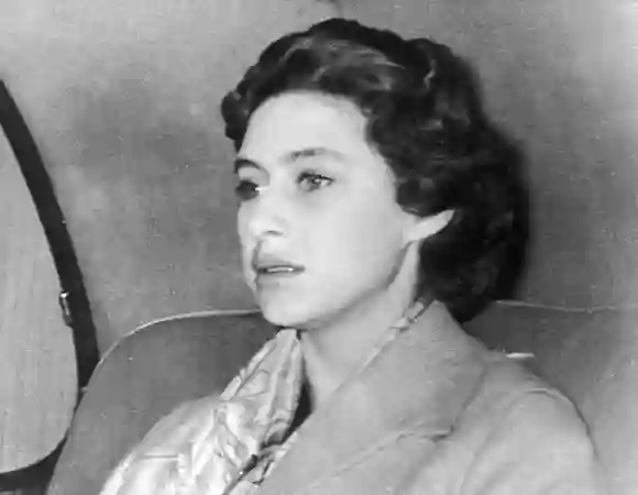 Princess Margaret returns to Clarence House October 17, 1955 after a weekend in the country where Group Captain Peter Townsend was also a guest.