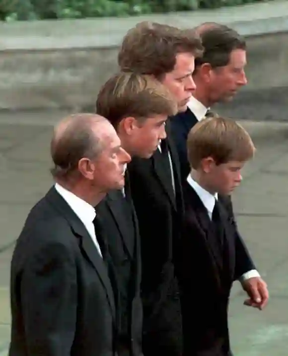 Prince Philip, Prince William, Earl Spencer, Diana's brother, Prince Harry, and Prince Charles walk together behind the carriage carrying the casket of Princess Diana in London