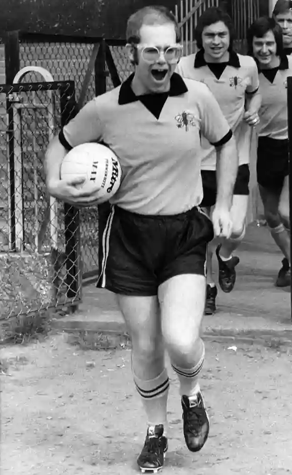 Elton John leading the Watford Football Club in 1974