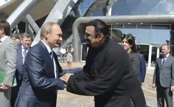 Sept 4 2015 Vladivostok Russia Russian President Vladimir Putin greets American actor Steven
