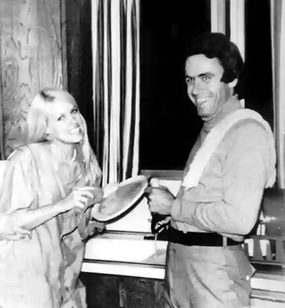Ted (Theodore) Bundy helps Carol Bartholomew clean up dishes from a 1975 birthday party