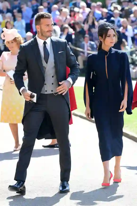 David Beckham and Victoria Beckham arrive at St George's Chapel in Windsor Castle ahead of Prince Harry's wedding to Meghan Markle on May 19, 2018 in Windsor, England.
