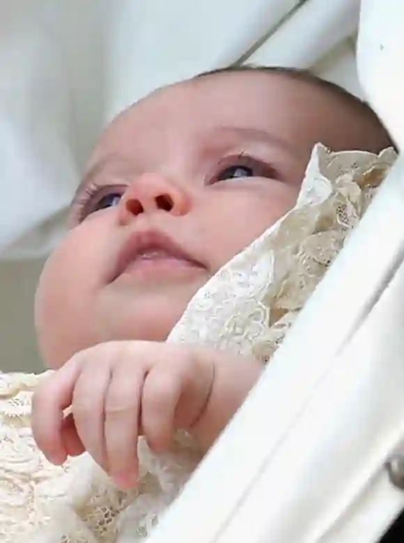 Princess Charlotte of Cambridge is pushed in her silver cross pram as she leavesthe Church of St Mary Magdalene on the Sandringham Estate for the Christening of Princess Charlotte of Cambridge on July 5, 2015