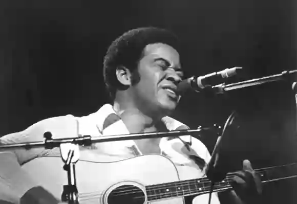 Bill Withers performing during the 'Save The Children' benefit concert in 1972.