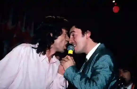 (L-R)  Singers  Mick  Jagger  and  Bruce  Springsteen  performing  w.  Bob  Dylan  (lower  R).DMI/