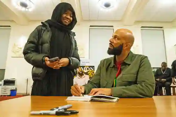 Syndication: Wilmington News Journal From left, Saige Everett, 18, interacts with, and gets her book signed by, Common,