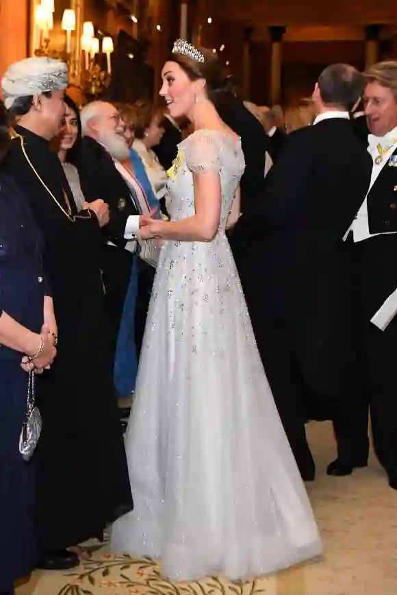 Duchess of Cambridge greets guests at an evening reception for members of the Diplomatic Corps at Buckingham Palace on December 04, 2018