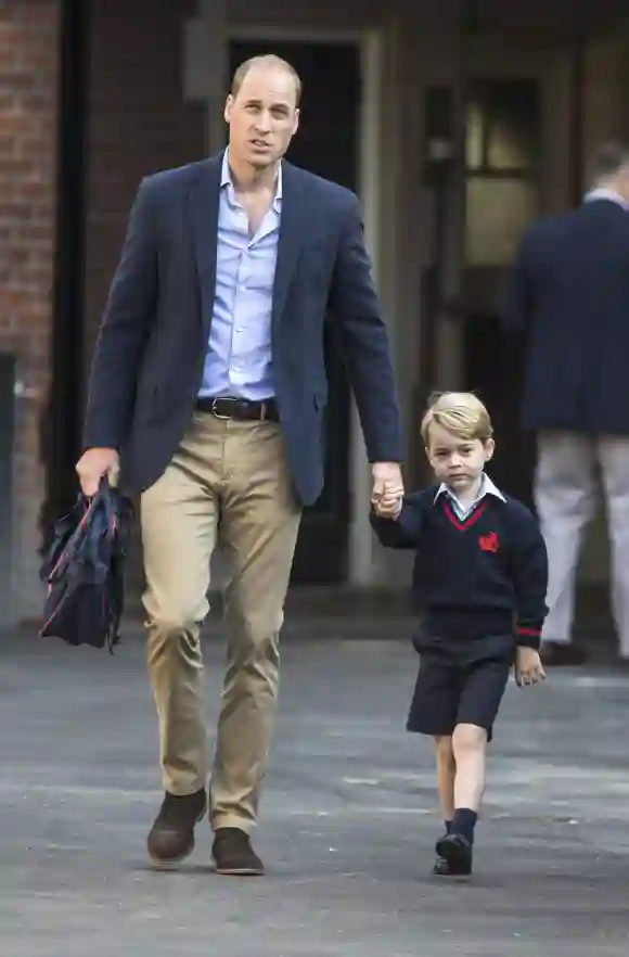 PAP09171777 Prince George holding the hand of his father Prince William Duke of Cambridge arrives