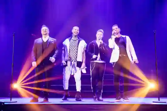 Keith Duffy, Stephen Gately, Mikey Graham, Ronan Keating, and Shane Lynch of Irish boy band Boyzone perform during their