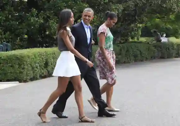 President Barack Obama, First Lady Michelle Obama and Malia Obama leave the White House for a Martha's Vineyard vacation on August 9, 2014. (Dennis Brack / DanitaDelimont.com)