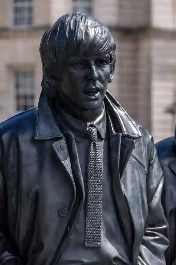 LIVERPOOL, UK - JULY 14 : Statue of George Harrison of the Beatles in Liverpool, England on July 14, 2021 LIVERPOOL, UK