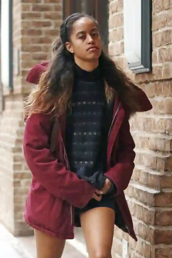 EXCLUSIVE: Malia Obama braves the rain by in shorts and a down rain jacket as she makes her way to her internship in New