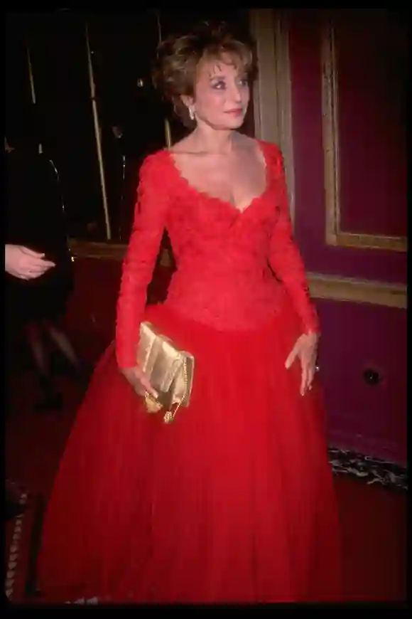 Newswoman  Barbara  Walters  wearing  a  low-cut,  red  ball  gown.DMI/The  LIFE  Picture  Collect