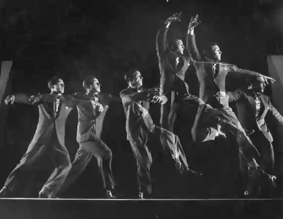 Dancer  Gene  Kelly  showing  off  his  balletic  grande  jetee  in  this  stroboscopic  studio  stu