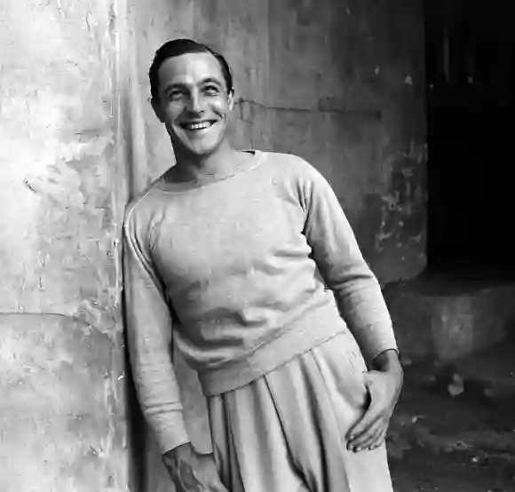 Portrait  of  American  actor,  dancer,  and  choreographer  Gene  Kelly  (1912  -  1996)  as  he  l